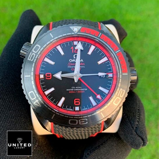 Omega Seamaster 215_92_46_22_01_0_3 Black Dial Replica on the hand grass background