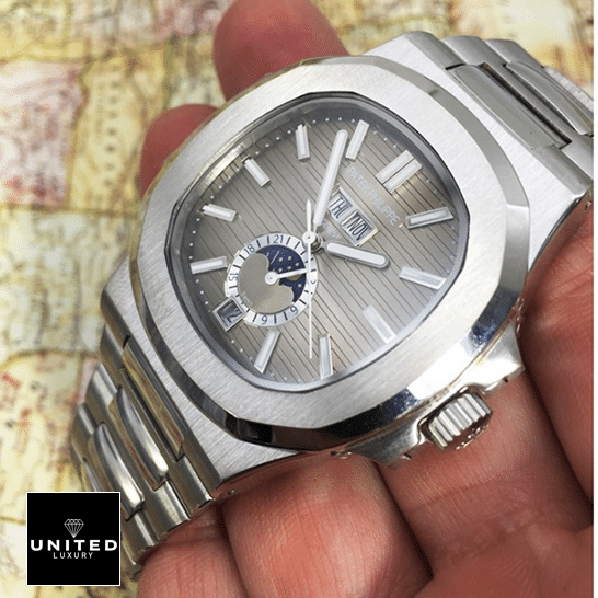 Patek Philippe Natilus Grey Dial Moon Steel Replica on the hand map background