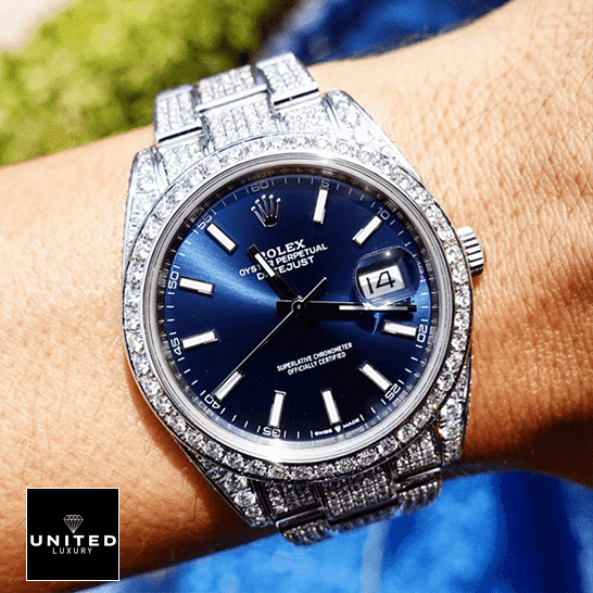 Rolex Datejust 126300 Blue Dial with white Stick Iced Out Replica on his arm