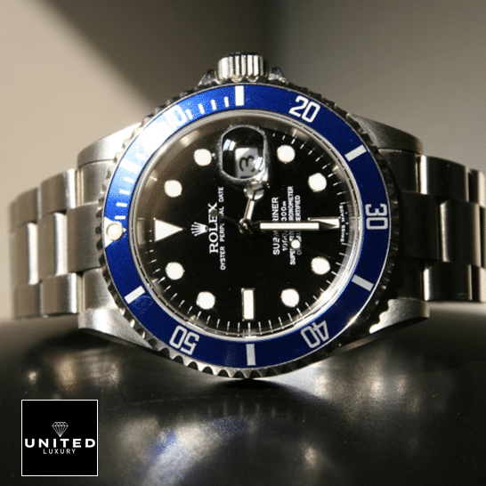 Rolex Submariner Date 16610 Black Dial Oyster Replica on the table