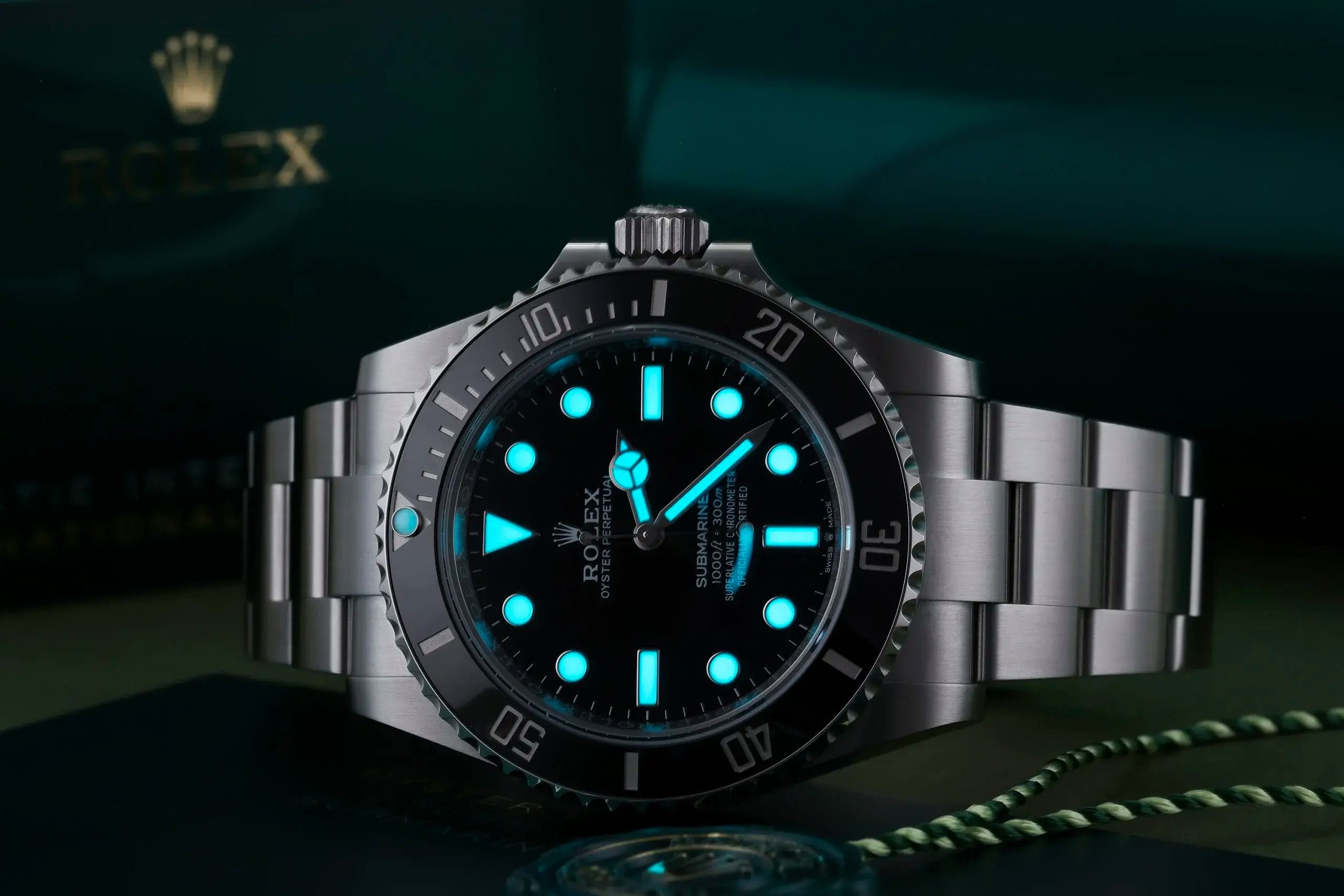 rolex submariner with bioluminescence on box
