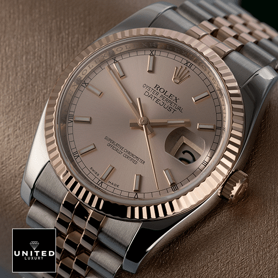 Rolex Datejust Sundust 126331-0010 Rose Gold Fluted Bezel Replica on the table