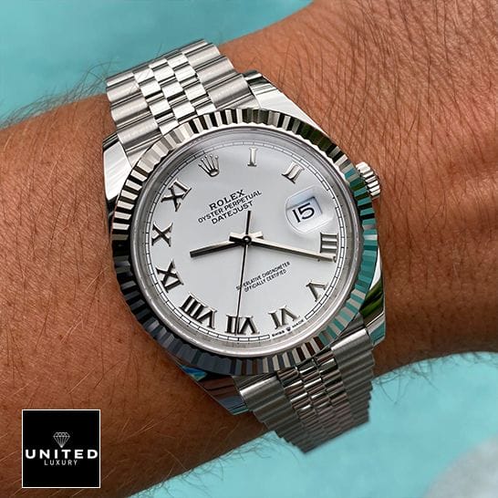 Rolex 126334 Datejust Fluted White Roman Dial Replica on the man wrist