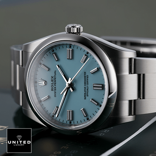 Rolex Perpetual 126000 Turquoise Dial Oyster Replica on the table