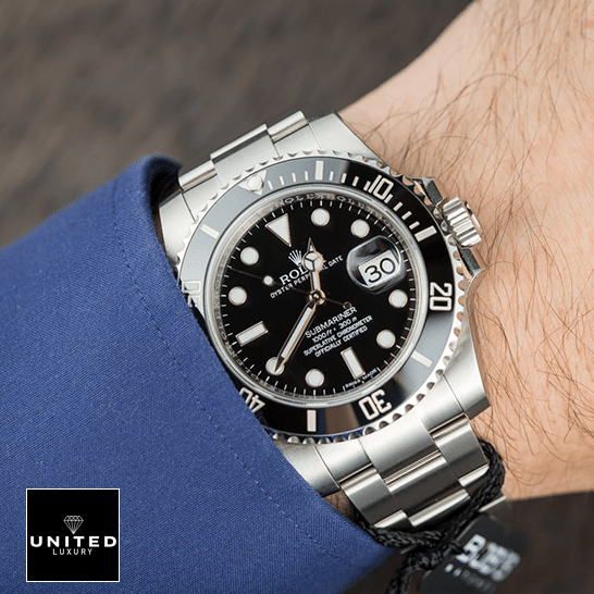 Rolex Submariner 116610LN Black Dial Replica on the wrist in a suit